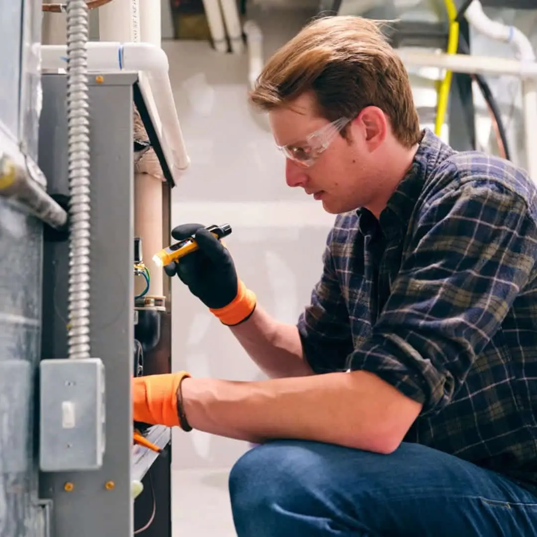 man working on hybrid hvac